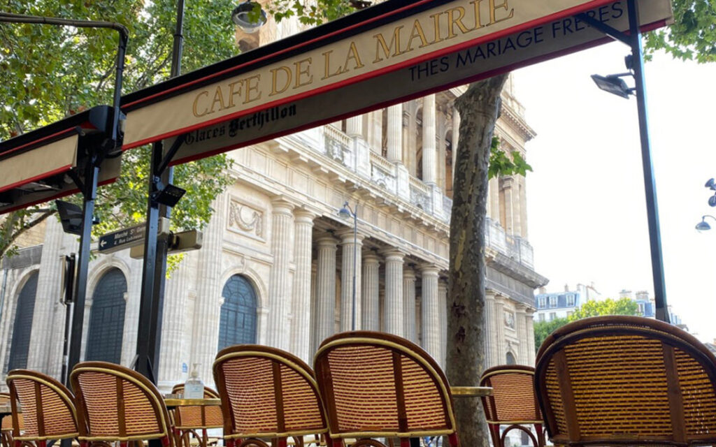 Outdoor seating at Café de la Mairie with a view of Saint-Sulpice church. Parisian cafés