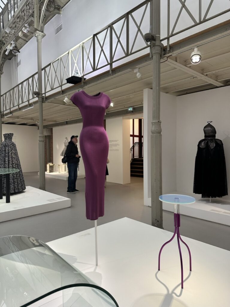 A purple Alaïa gown paired with a minimalist purple table by Shiro Kuramata.