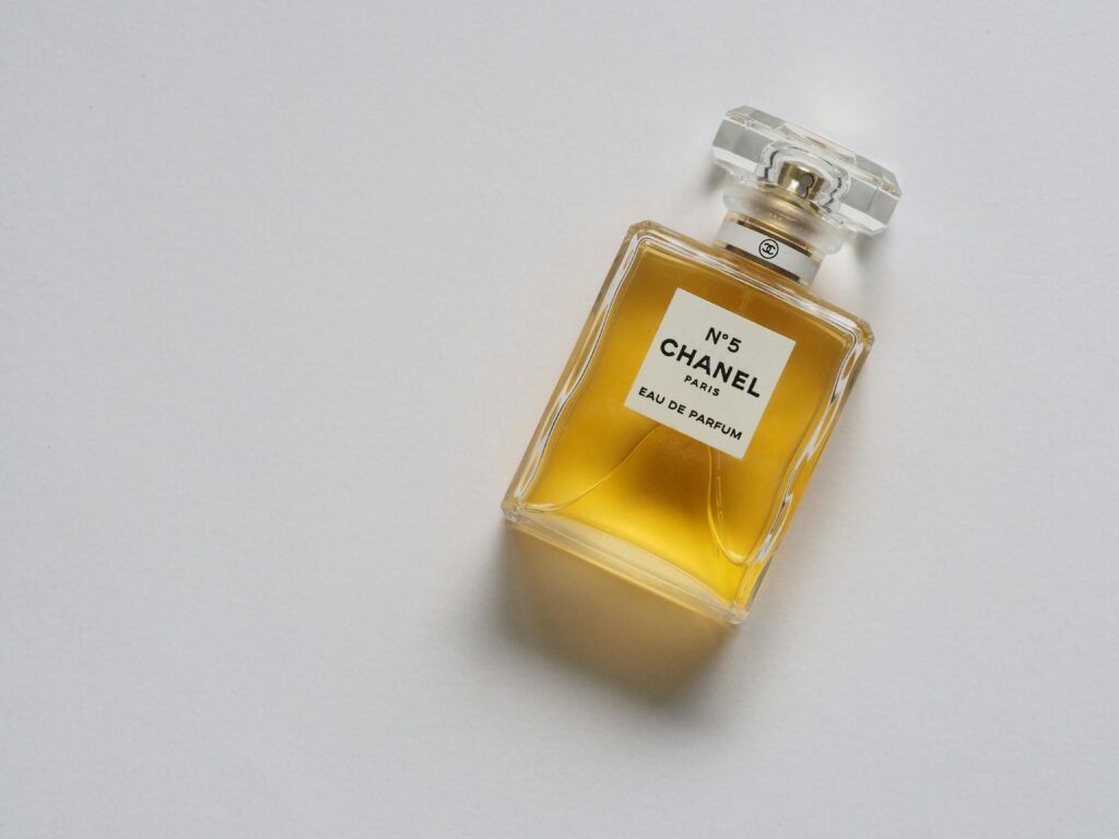 Chanel No. 5 perfume bottle placed on a white background. French perfume brands.