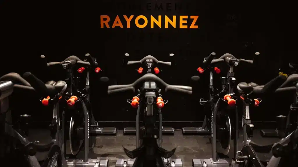 Close-up of stationary bikes at Dynamo, one of the best indoor cycling studios in Paris Best workout classes in Paris.