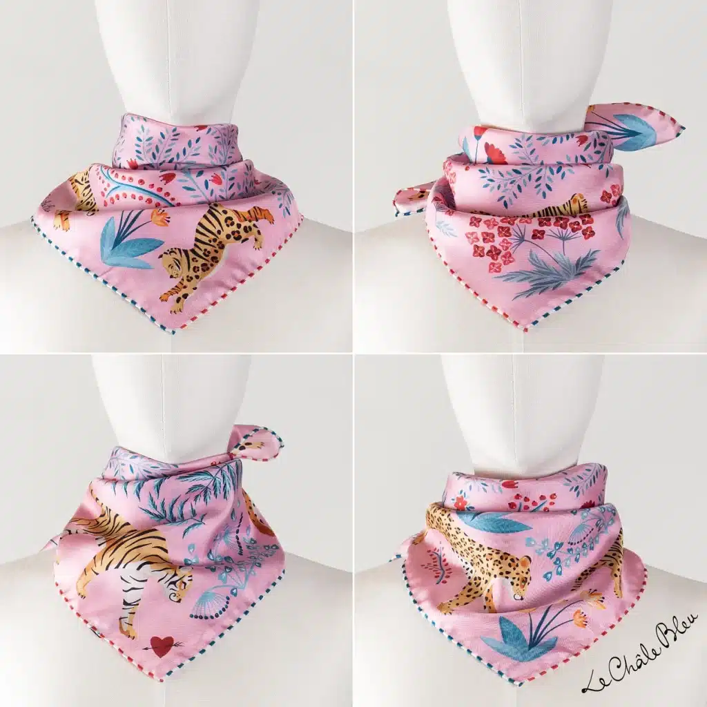 A pink silk bandana from Le Châle Bleu with a playful jungle-inspired print.