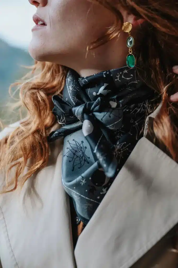 A celestial black silk scarf from Petrusse, featuring star and constellation prints.