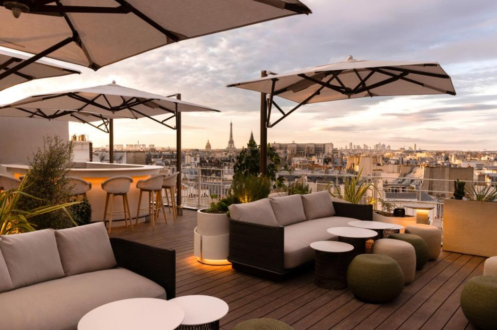 Romantic rooftop view of Paris rooftops at sunset