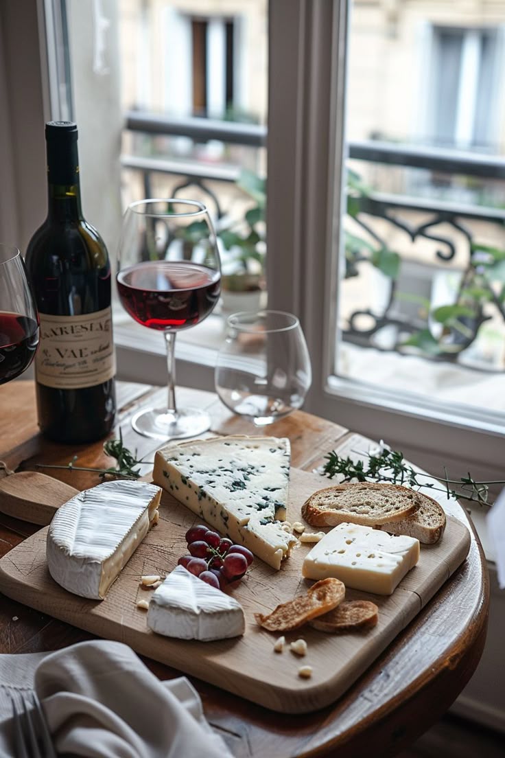 French cheese platter with wine, showing how to eat like a French woman with pleasure and moderation.
