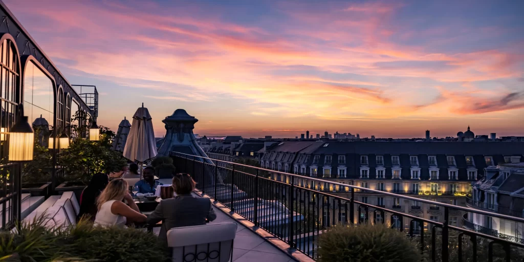 Stylish rooftop seating with Eiffel Tower view at Kimpton Paris