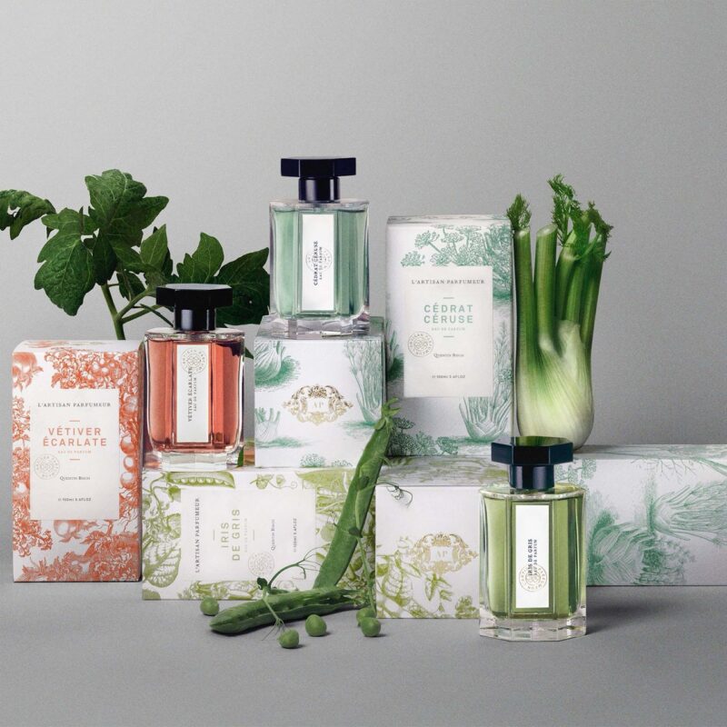 A curated perfume collection by L’Artisan Parfumeur with greenery and natural ingredients