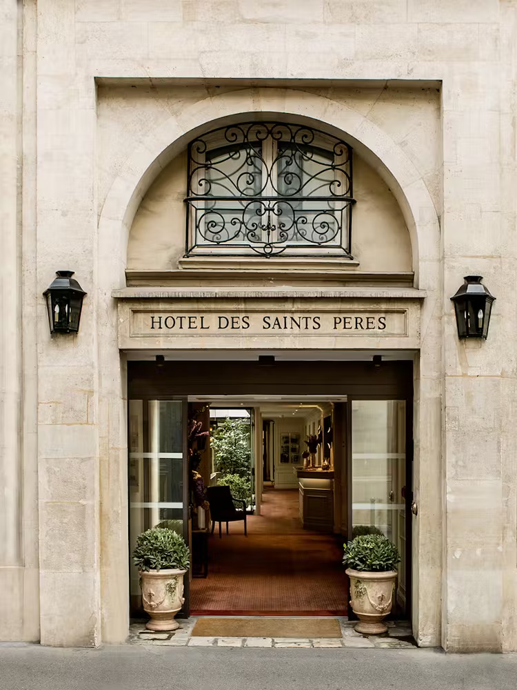 Chic Parisian hotel room with French decor and glass divider