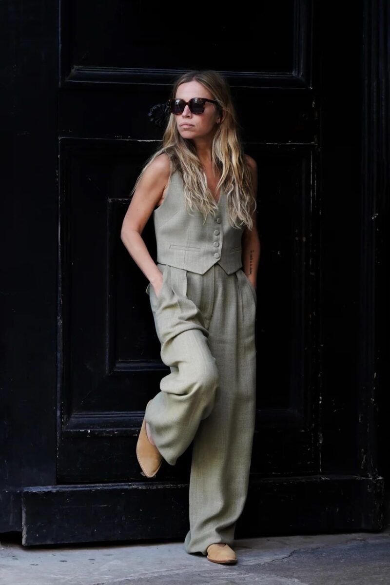 Parisian woman wearing sage green tailored vest and pants by Margaux Lonnberg, a brand like Sézane