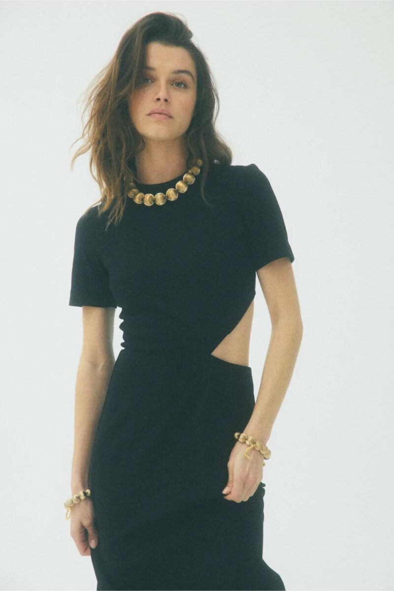 Model wearing elegant black cut-out dress by Martin Martin, a chic brand like Sézane