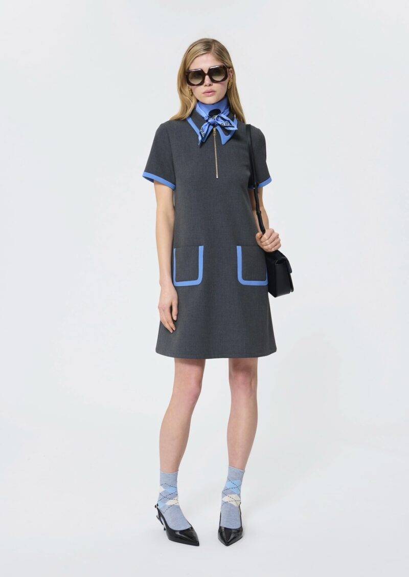 Model in grey mini dress with blue piping by Tara Jarmon, a playful French brand like Sézane
