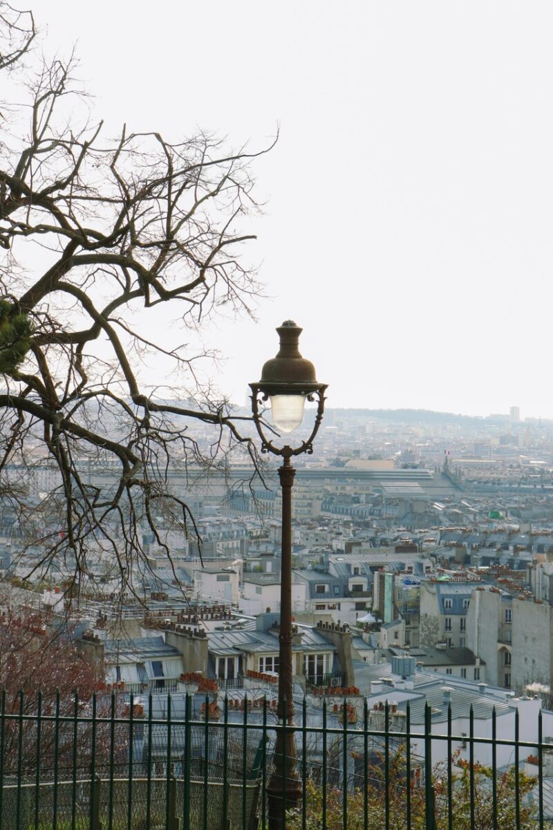 Winter street scene in Montmartre Paris Neighborhood with bare trees and classic buildings