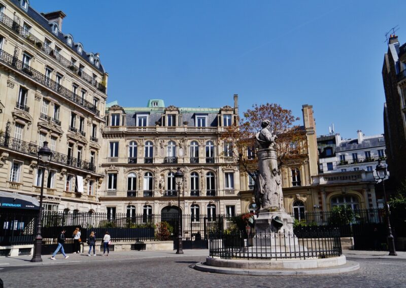 Historic buildings and statue at Place Saint-Georges in the 9th arrondissement of Paris