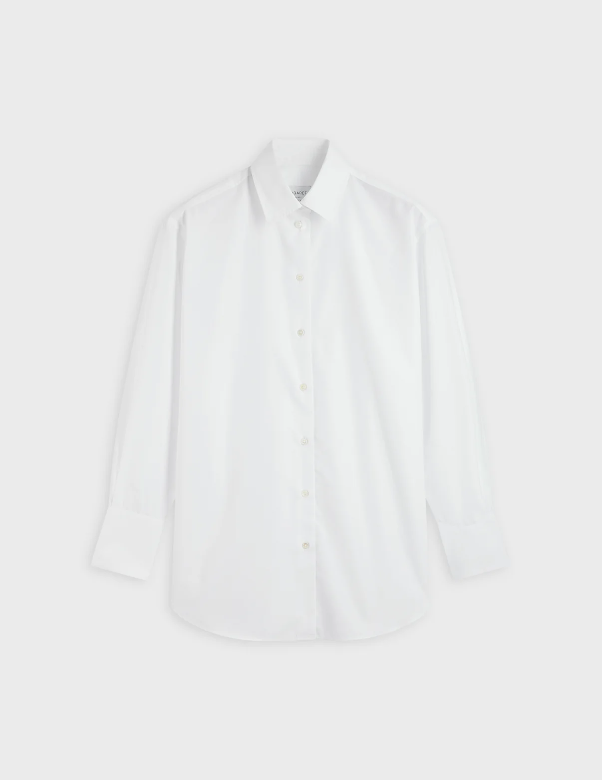 parisian style crisp white shirt by the brand Figaret Paris one of 10 Parisian Style Staples You Can Add to Your Closet Right Now