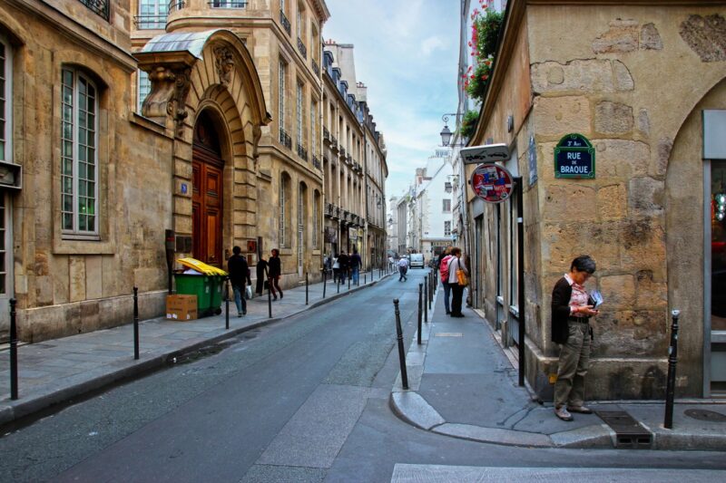 Narrow cobblestone street in Le Marais, Paris