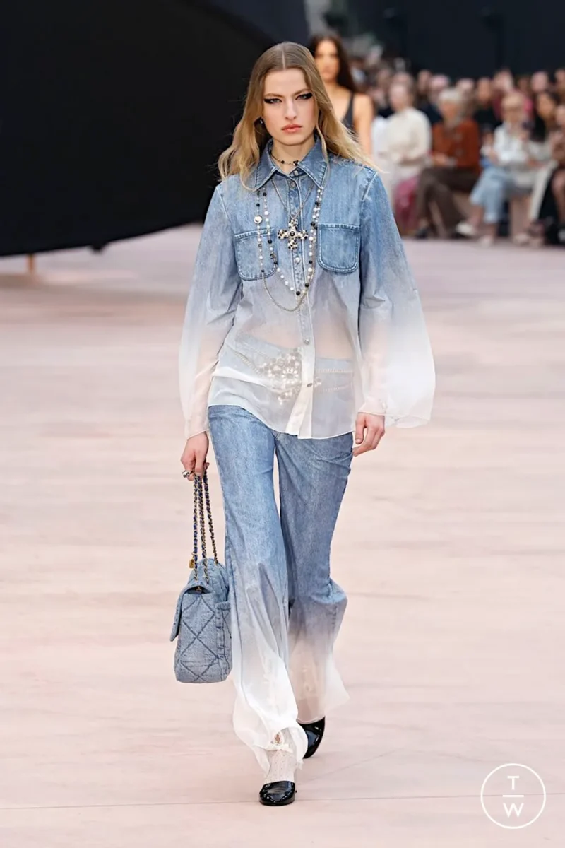 Chanel AW25 runway look with double denim and pearls, a couture-inspired take on Parisian style jeans.