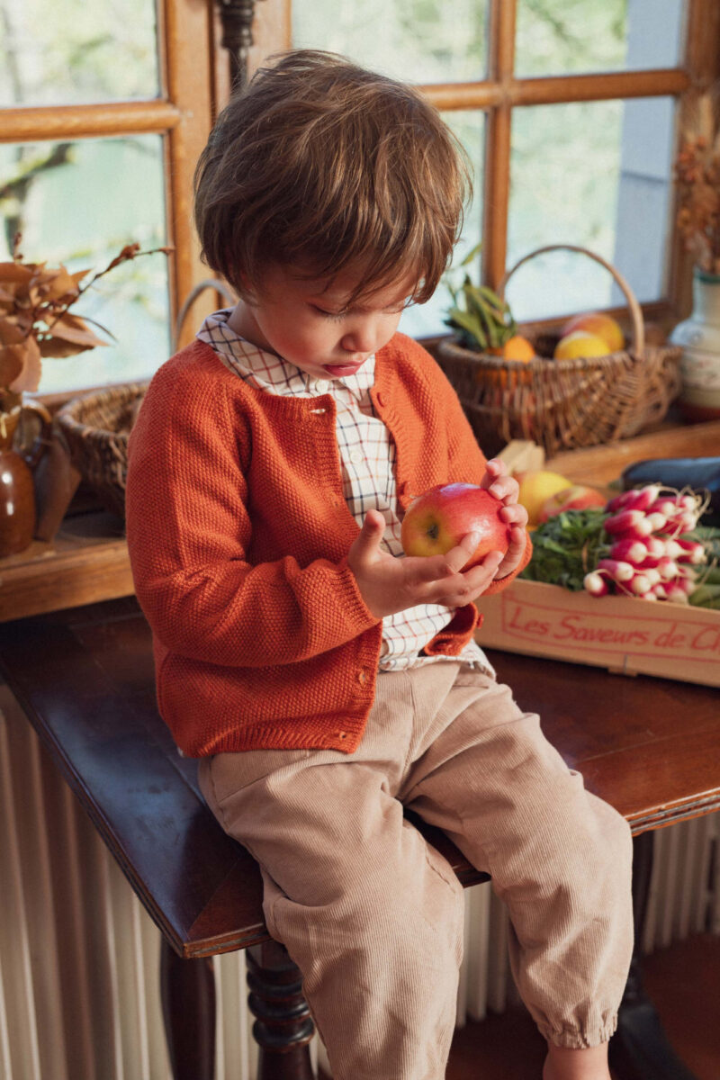 Baby boy in a fall outfit from Marie Puce Paris, a French baby clothing brand.