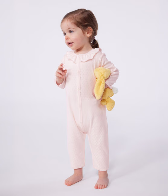 Pink cotton baby pajamas from Petit Bateau with simple ruffle detail