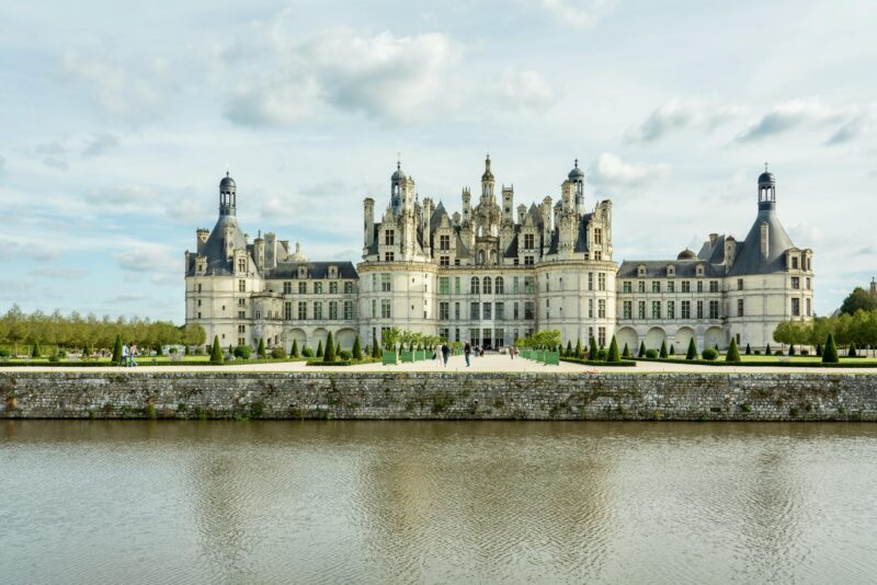 Château de Chambord, an iconic Renaissance castle in the Loire Valley France, seen from across the moat.
