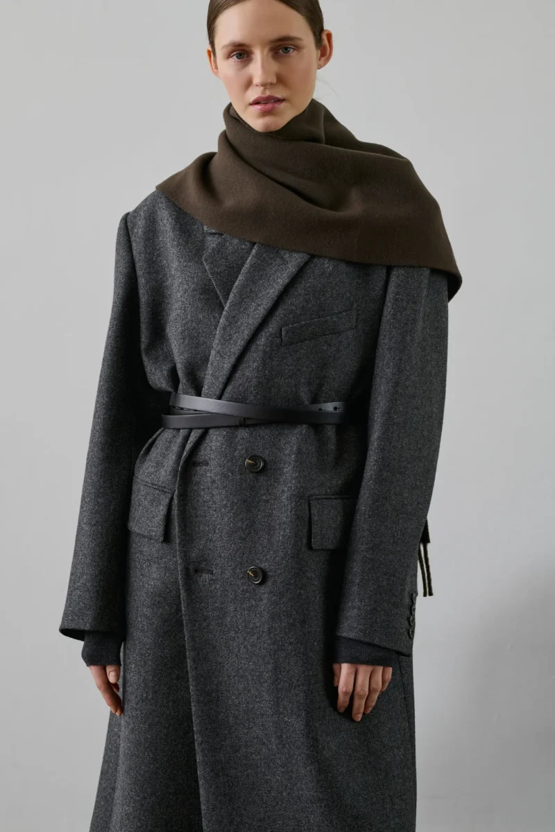 Model wearing a French scarf by Soeur, brown wool wrap styled over a tailored grey coat.