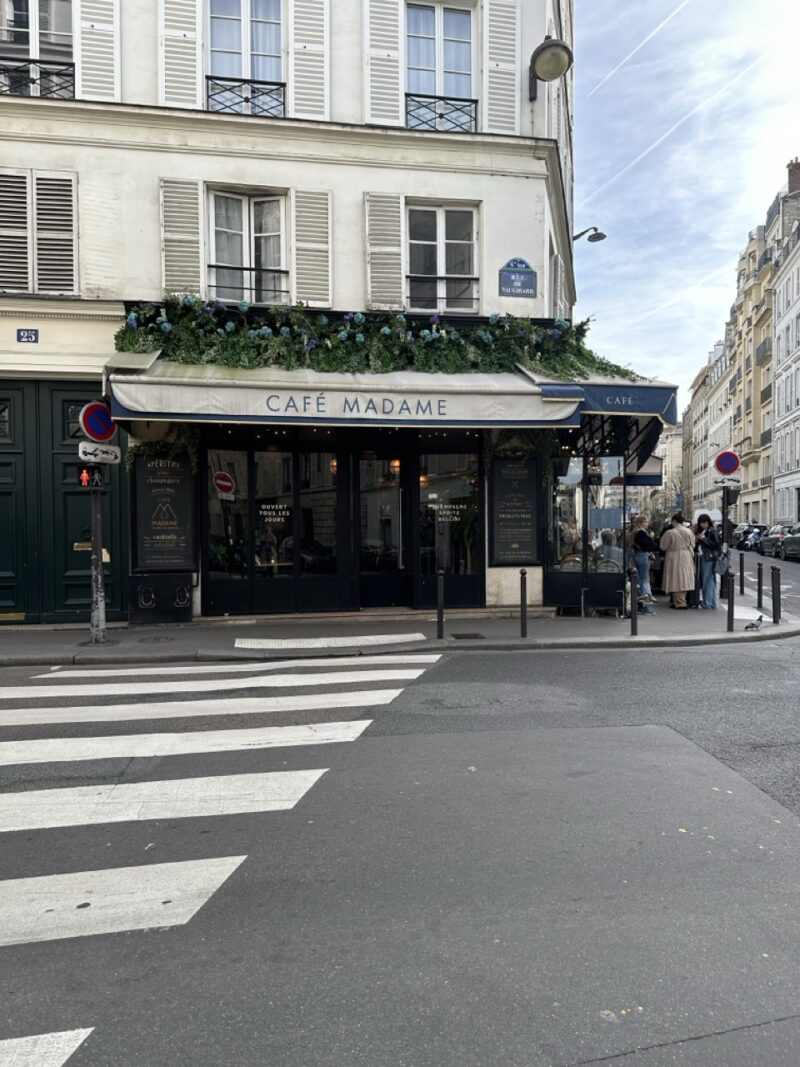 Café Madame on Rue de Vaugirard in the 6th arrondissement of Paris. A sunlit café terrace captures the relaxed, elegant rhythm of Saint-Germain mornings — the perfect mood for discovering Paris’s most atmospheric neighborhood.