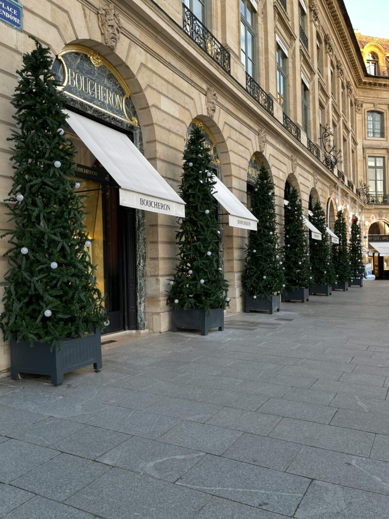 Elegant Christmas trees in front of Boucheron boutique on Place Vendôme in Paris.