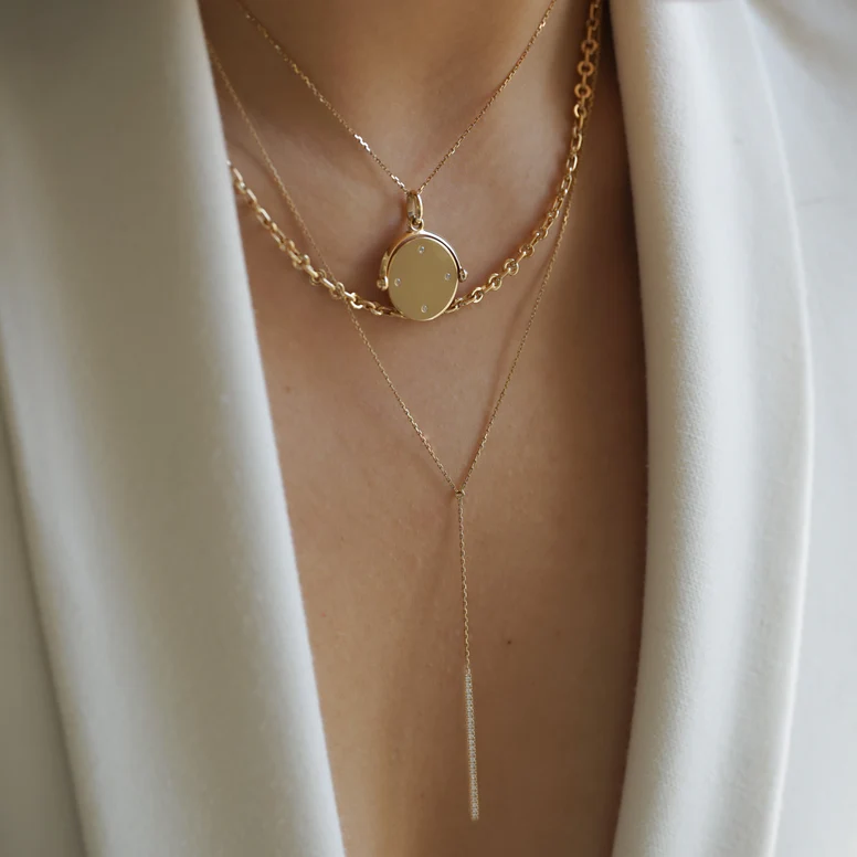 Close-up of recycled gold and diamond necklace by Douze Paris.