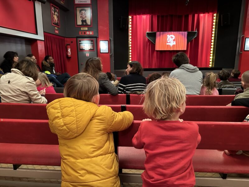 children watching the Guignol puppet show in Paris