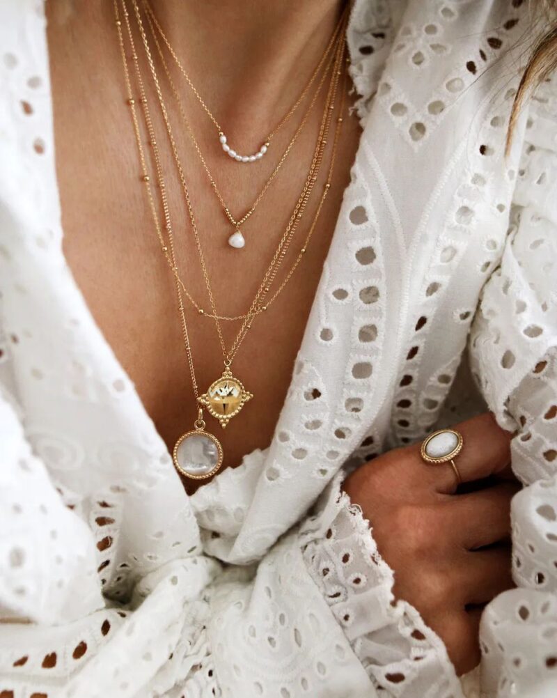 Model wearing Labelle gold necklace