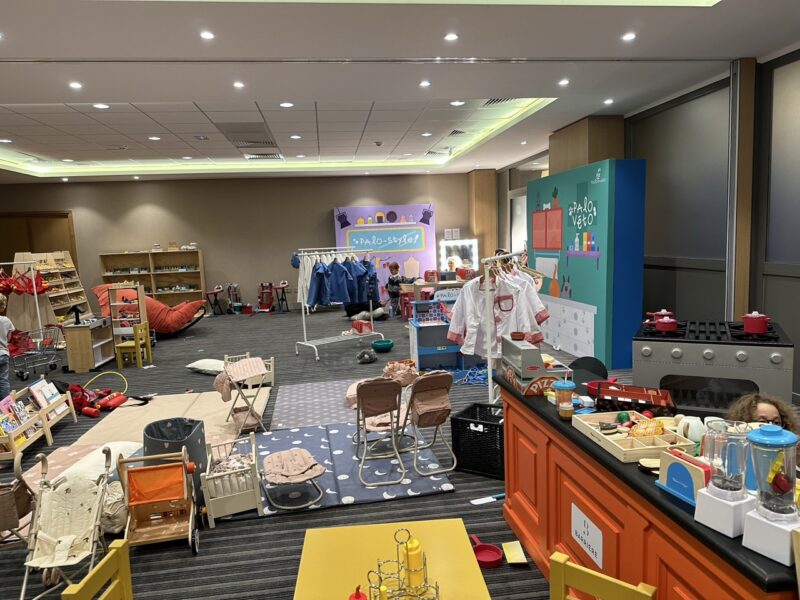 indoor play space at Palomano City Paris with realistic toys and dress-up stations for toddlers