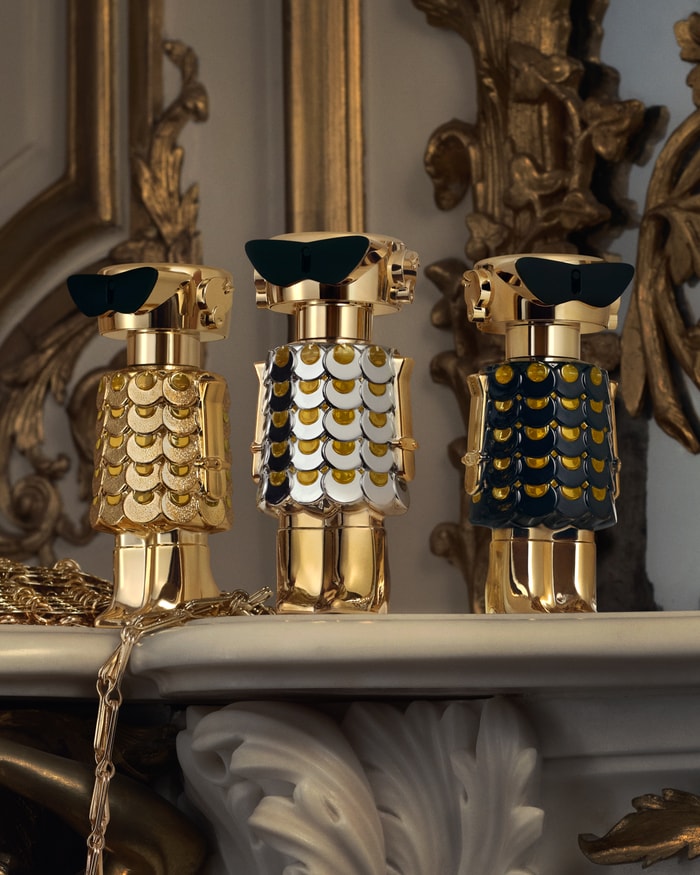 Rabanne Lady Million and Olympéa bottles in a gold setting, best-sellers among French perfume brands.